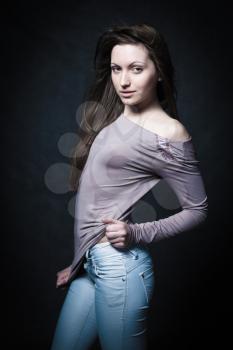 portrait of a young girl in sexual youth jeans