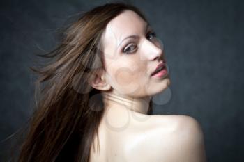 Fashion photo of beautiful seminude woman with magnificent hair