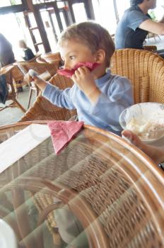 boy child cute eating ice cream in cafe