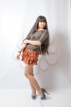 Young asian student. Beautiful young woman. Portrait of asian woman in brown skirt