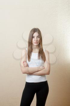 pretty yound slim woman torso shot on white background in sport form indoors health concept