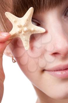 female part face closeup, studio shot with seastar