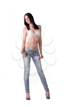 brunette in white bra with long black hair and jeans isolated on white front view looking at camera