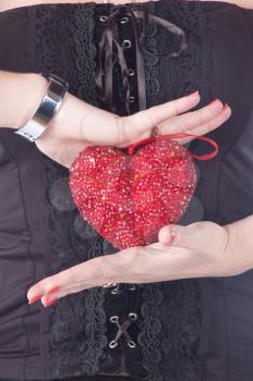 love concept. holding a red heart in hands.