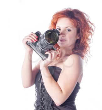 Portrait of a beautiful woman with the camera. Fashion photo