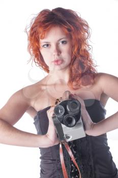 Portrait of a beautiful woman with the vintage camera