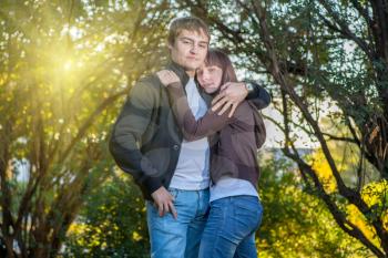 Young Couple of College Students outdors embracing