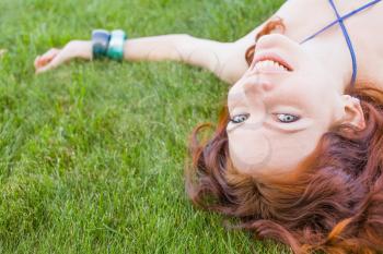 redhead on grass closeup