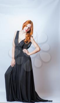 redhead 20s female full body in black dress,studio shot