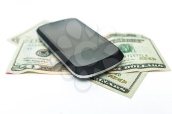 mobile phone and money on white