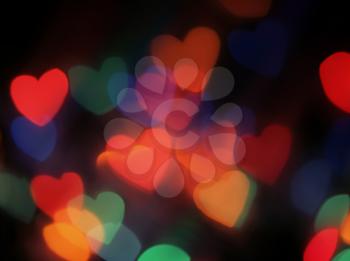 Heart shaped blurred lights. Colorful blurred bokeh lights