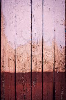 Rustic wooden wall with rundown two-color paint. Home interior DIY project. Messy board half brown color.