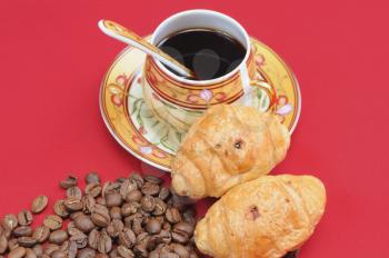 Royalty Free Photo of a Cup of Coffee and Croissants