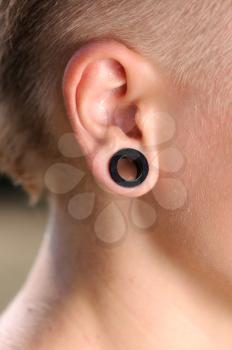 Royalty Free Photo of a Teenager Wearing an Earring