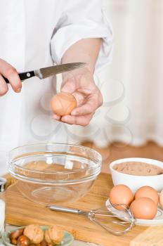 Royalty Free Photo of a Person Preparing Eggs