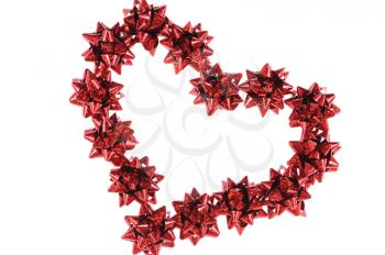 Heart from red bows isolated on white background