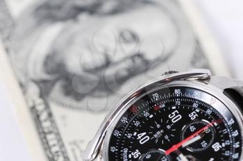 Royalty Free Photo of a Watch Beside Money