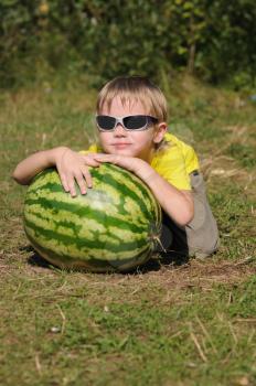 Royalty Free Photo of a Boy With a Watermelon