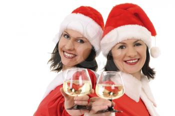 Royalty Free Photo of Two Women in Santa Hats Toasting