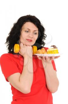 Royalty Free Photo of a Woman Exercising and Looking at Food