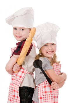 two children in chef's hat isolated on white background