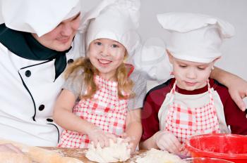 chef and children in the chefs prepare a meal