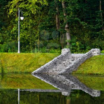 Royalty Free Photo of a Stone Staircase Reflected in the Water