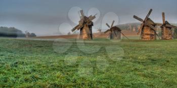 Royalty Free Photo of Windmills in the Fog