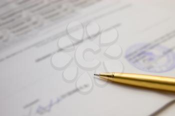 Royalty Free Photo of a Pen on a Contract