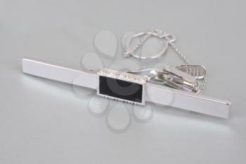 Royalty Free Photo of a White Gold Tie-Clip