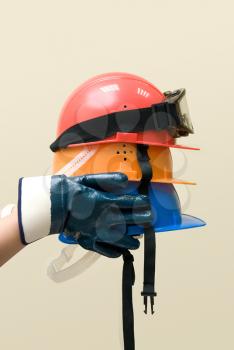 Royalty Free Photo of Hands Holding Hardhats