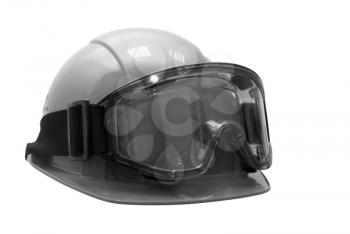 Build helmet with goggles on white. Black and white photo