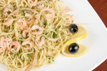 Royalty Free Photo of Pasta With Shrimp and Lemons