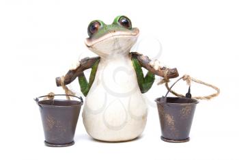 Statuette of frog with buckets on white