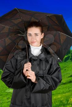 Royalty Free Photo of a Woman Holding an Umbrella 