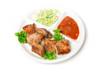 Grilled meat with sauce and vegetables isolated on white background