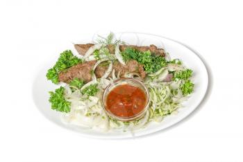 minced mutton chop with sauce and vegetables at dish