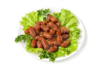 grilled sausages on green lettuce with isolated on white
