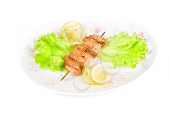 salmon kebab at plate isolated on a white background