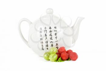 Royalty Free Photo of a Teapot and Berries