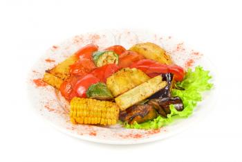 Fried vegetables on a grill isolated on a white