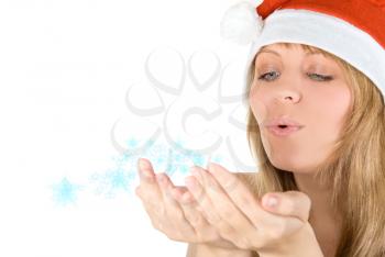 Royalty Free Photo of a Woman Blowing Snow