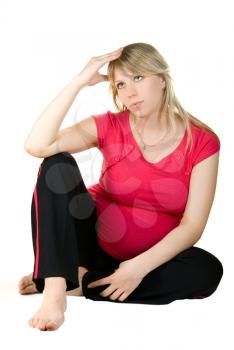 Royalty Free Photo of a Pregnant Woman Sitting 