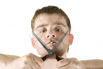 Royalty Free Photo of a Man Smoking and Holding Scissors