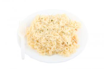 portion of spaghetti in a dish with fork on white background