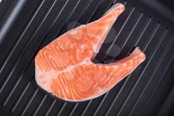 Royalty Free Photo of Trout Steak on a Grill Pan