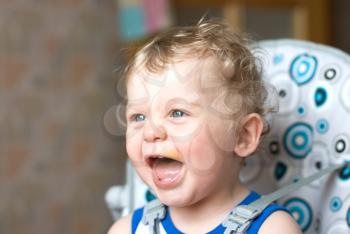 Royalty Free Photo of a Baby Boy With Food on His Face