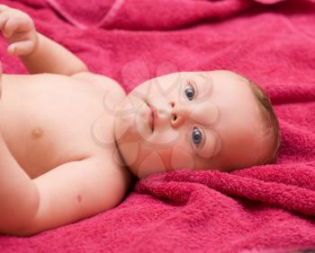 Royalty Free Photo of a Baby Boy Laying on a Towel