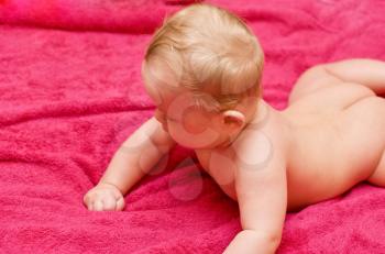 Royalty Free Photo of a Baby Boy Laying on a Towel
