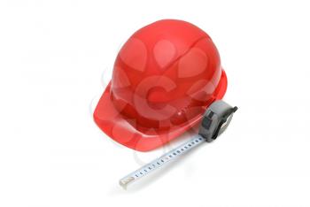 Red Safety helmet and measuring tape isolated on white

